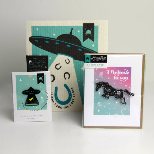 Alien abduction bundle for equestrian gag gift including greeting card, lapel pin and swedish dishcloth with aliens and horses